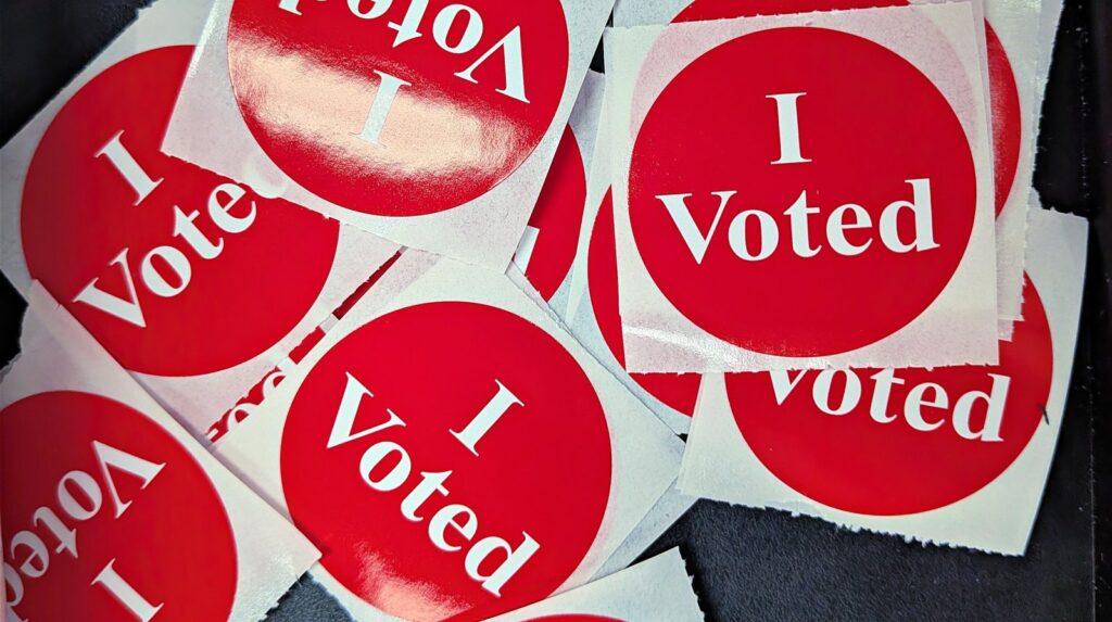 Pile of red 'I Voted' stickers